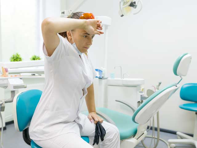 tired-woman-dentist-backgro